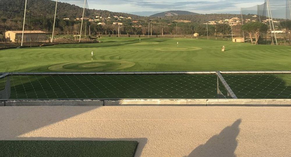 Oakley Synthetic turf beside natural grass golf course