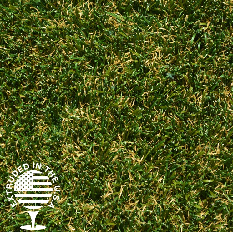 Close up image of artificial grass that is green with some brown strands.