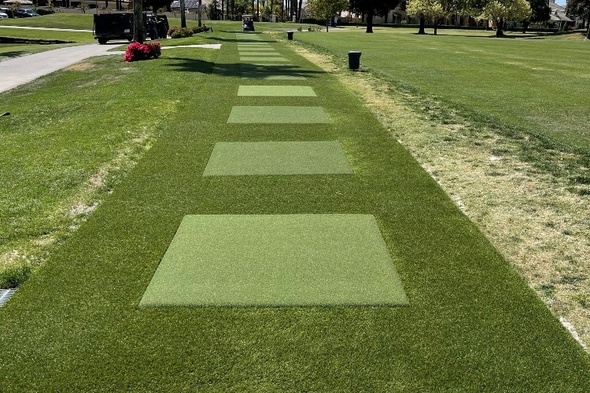 Oakley Outdoor tee line with light green synthetic grass boxes inside a dark green synthetic grass strip